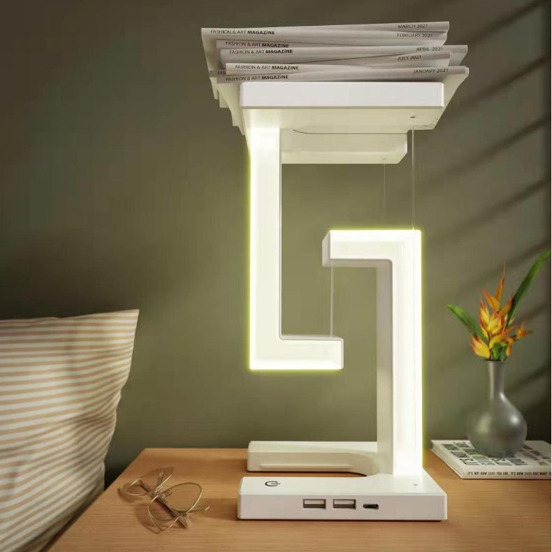 Creative stcraftdigital wireless charging table lamp with floating balance design, ideal for home or bedroom decor.