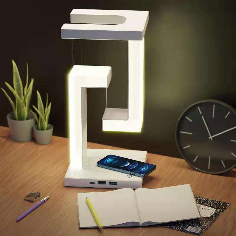 Wireless charging suspension table lamp by stcraftdigital featuring a floating balance design for home and bedroom lighting.